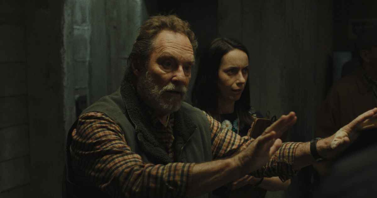 man with hand up in a hold on position with a woman